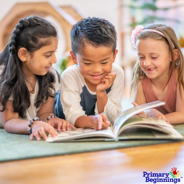 Preschoolers are reading a book for Dr. Seuss Day