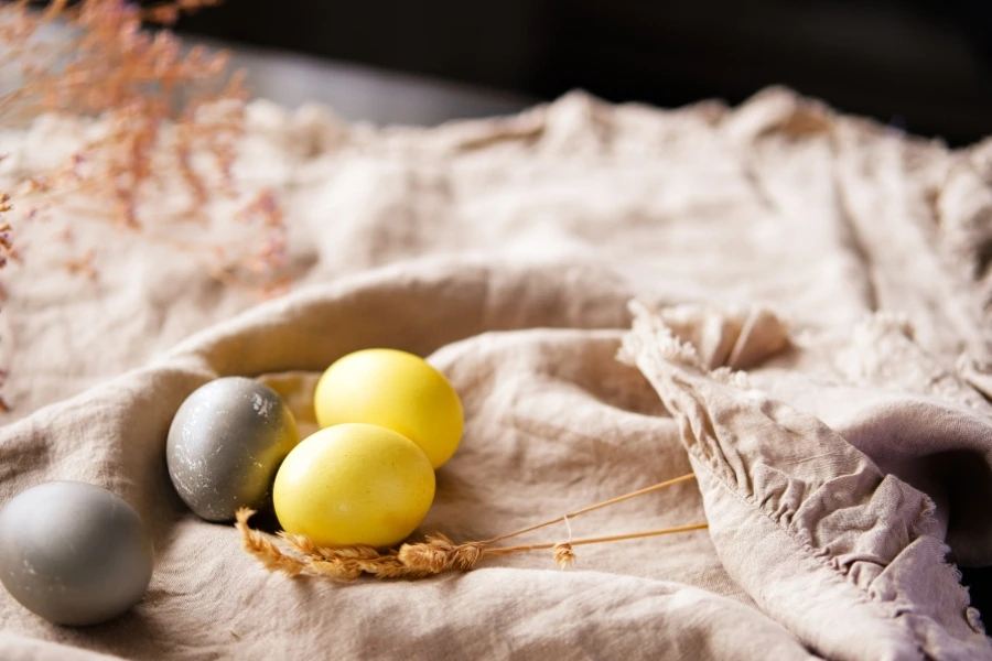 A photo of yellow died eggs on a terry cloth for the blog titled, "Easter Activities for Toddlers." 